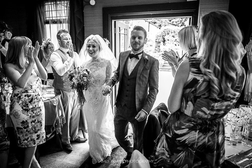 bride and groom walking into belle epoque