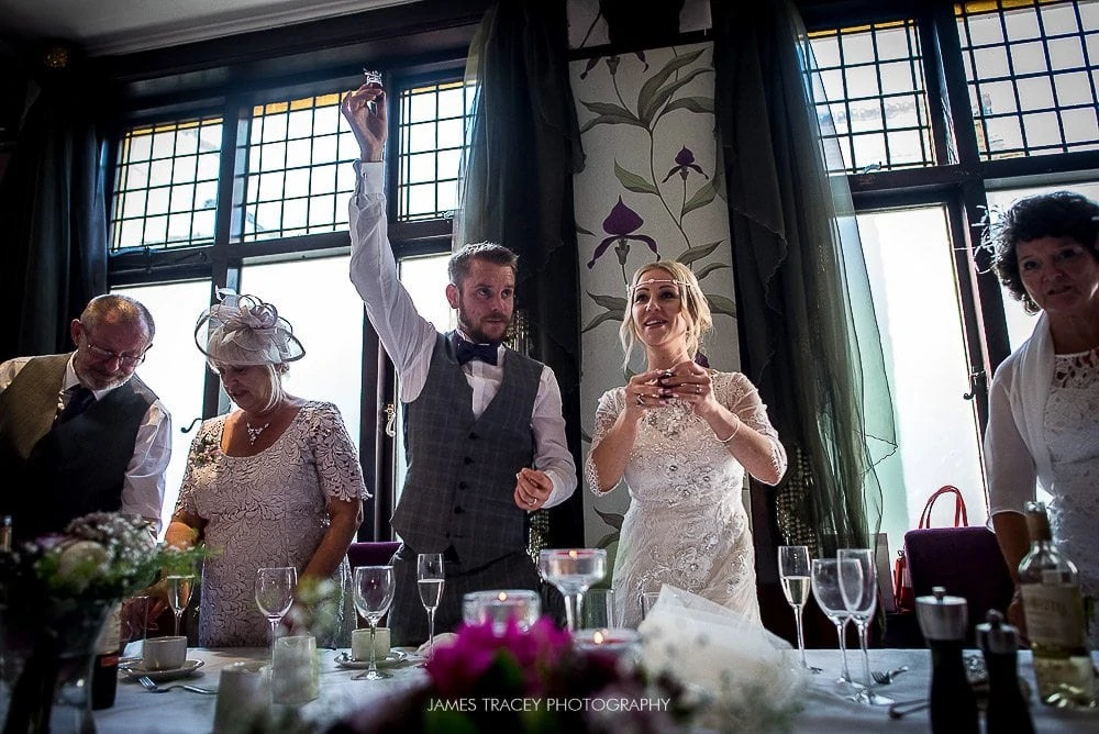 groom doing a toast