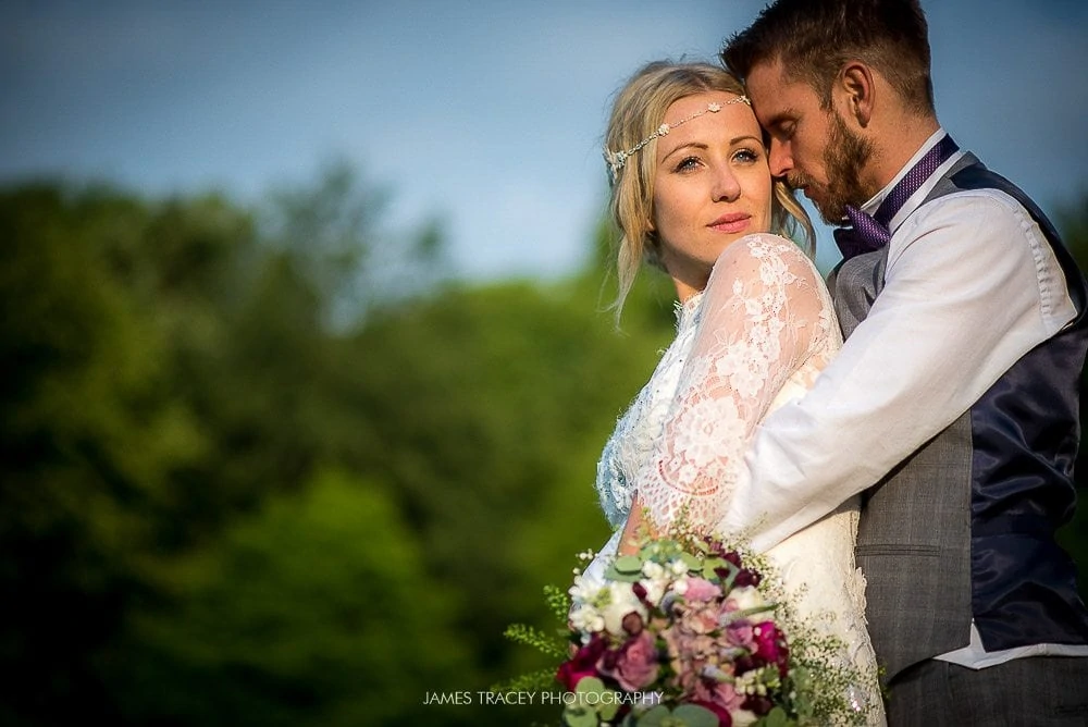 groom hugging bride