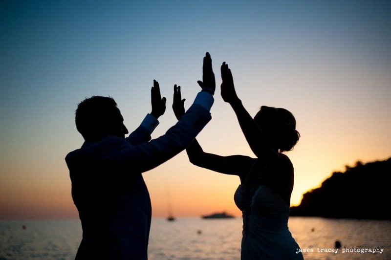 bride and groom high fiving in ibiza