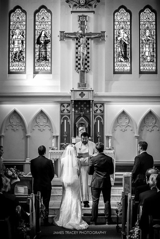 bride and groom getting married in church