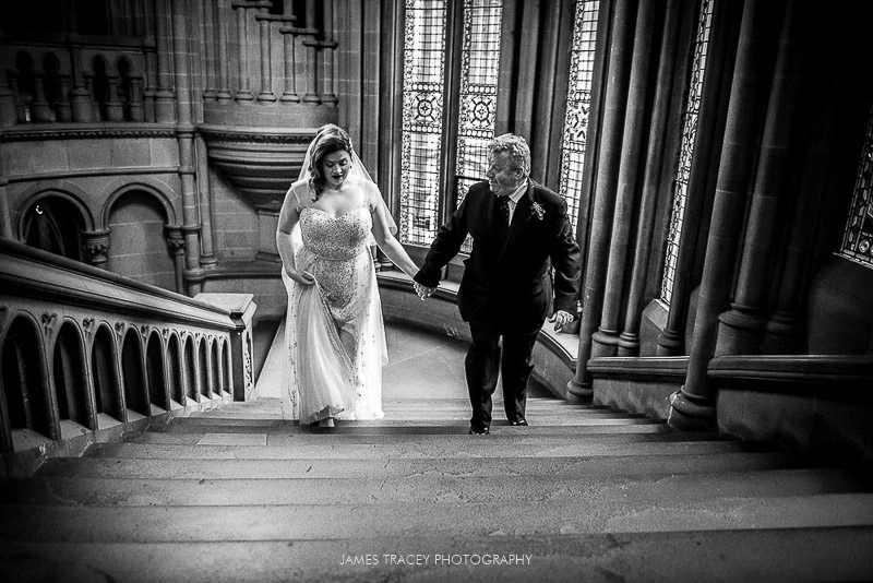 bride walking up stairs at manchester town hall