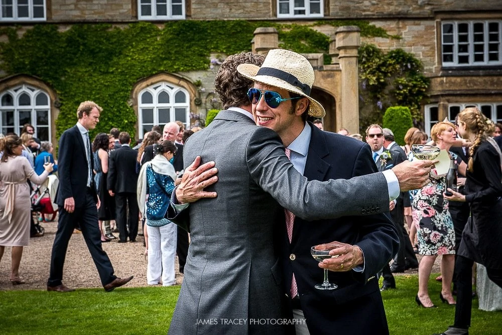 hugging wedding guests