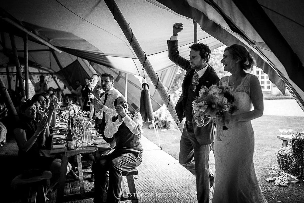 walking into wedding reception in tipi