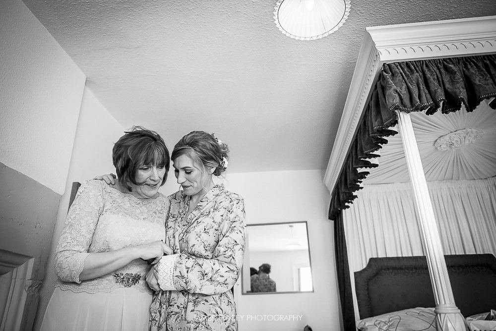 bride being hugged by her mum