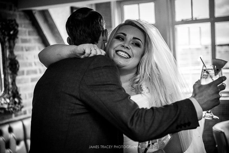 bride hugging wedding guests