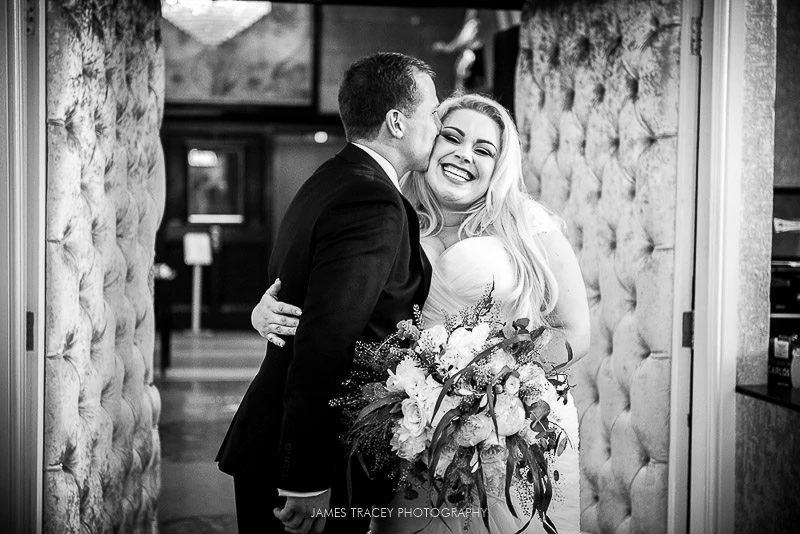 bride and groom walking into reception