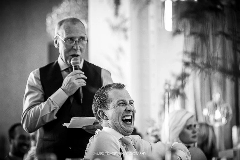 father of the bride with laughing groom