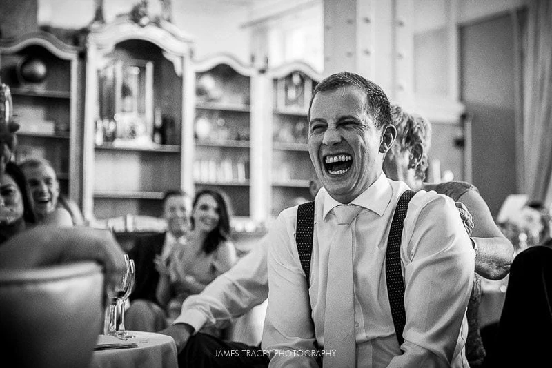 groom laughing loudly