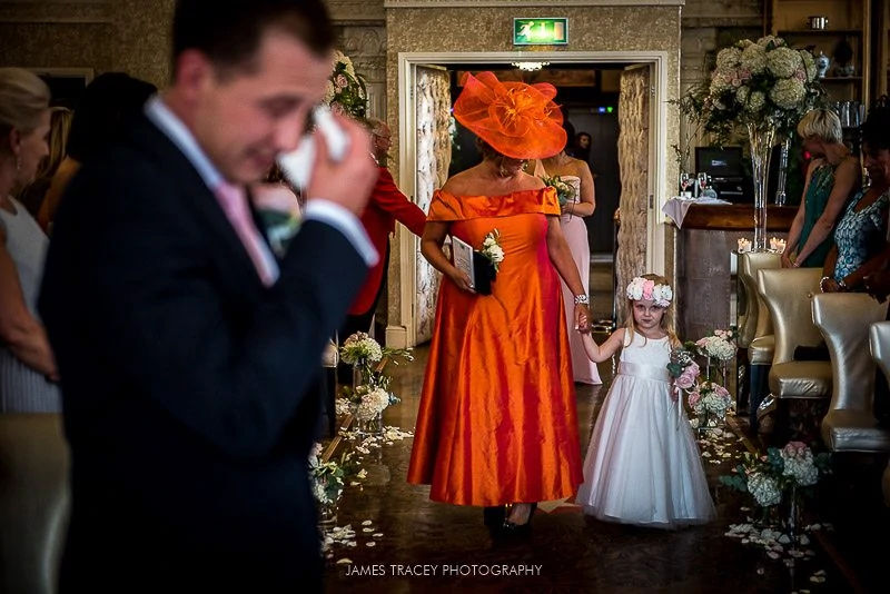 grooms daughter walking up the aisle 