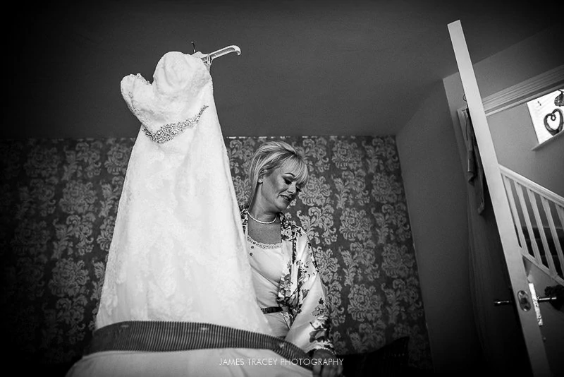 brid getting her wedding dress out