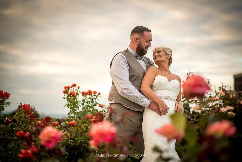 bride and groom in flowers