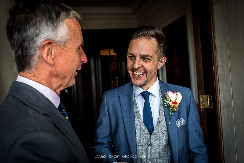 groom greeting guests