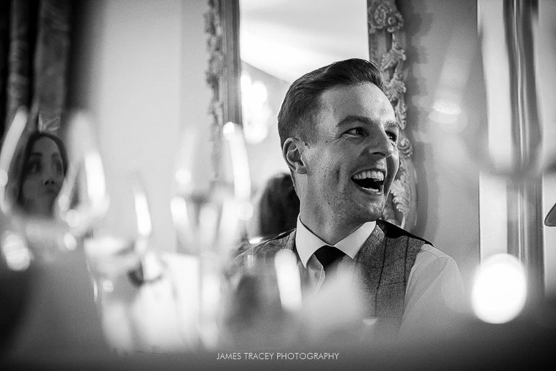 groom laughing at best man