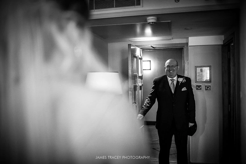 father of the bride smiling