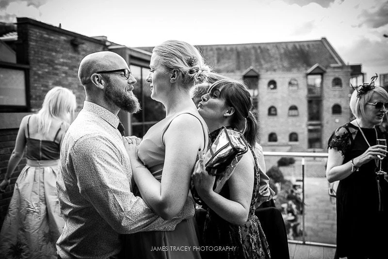 wedding guests kissing