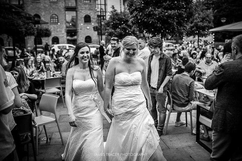 two brides being cheered