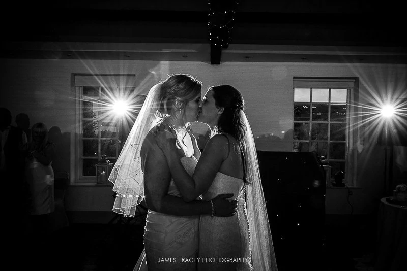 bride and bride kissing