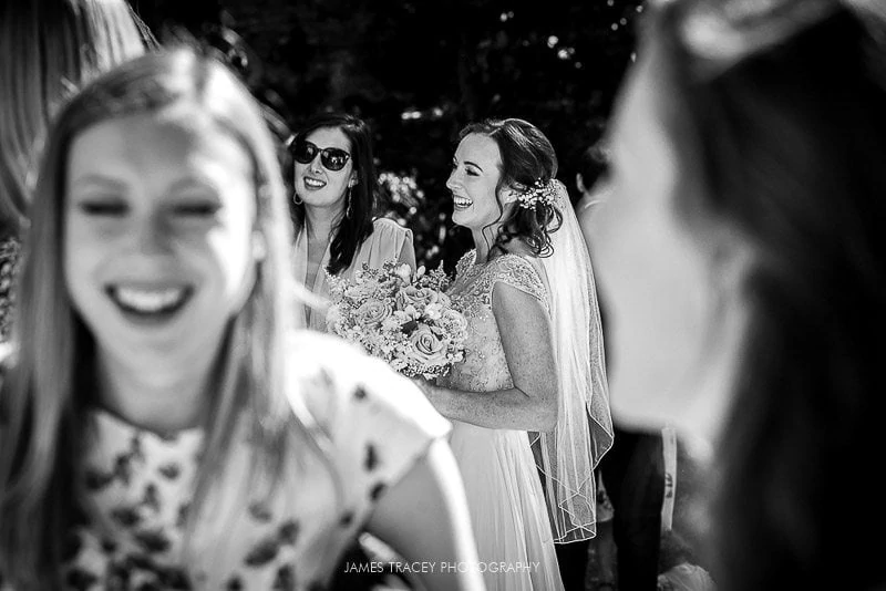 bride laughing with guests