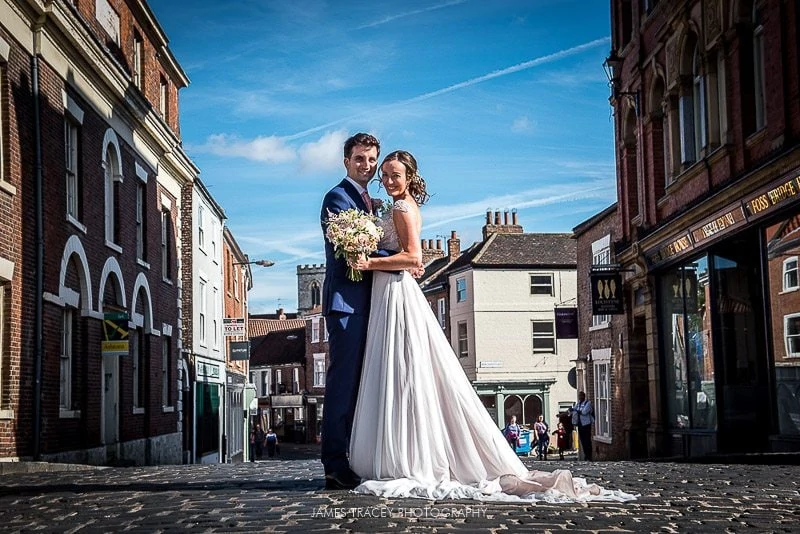 bride and groom on a bridge in york