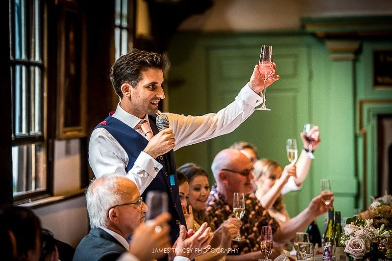 groom toasting wedding guests