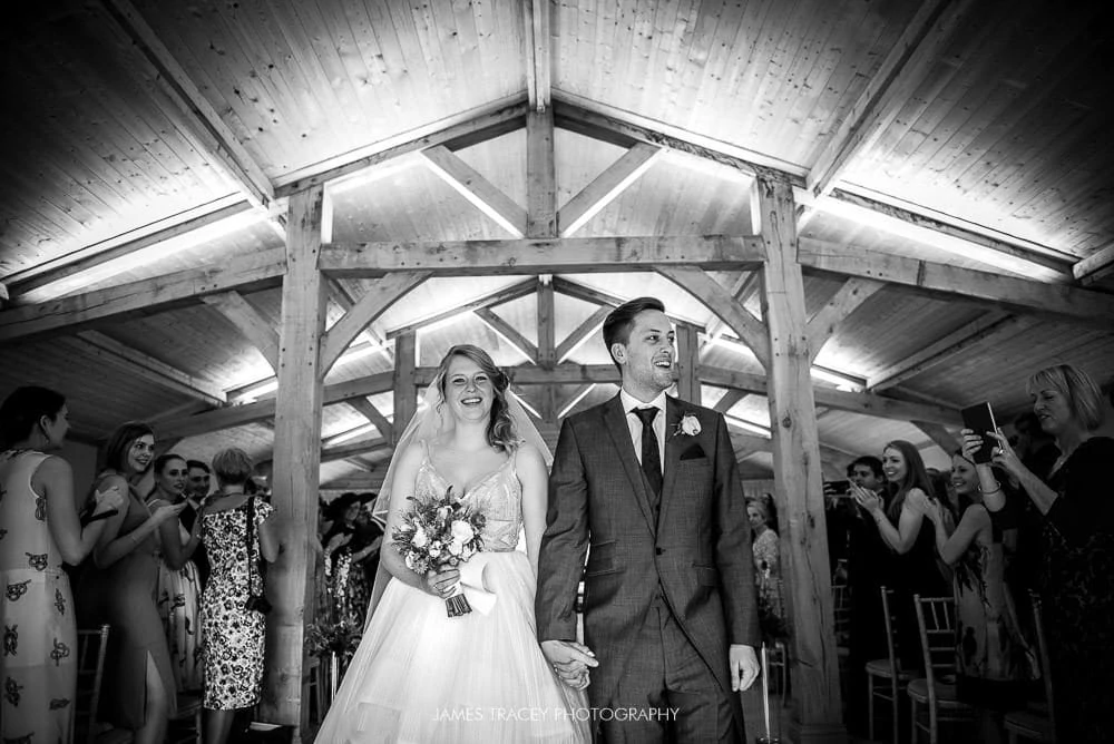 bride and groom leaving colshaw hall wedding
