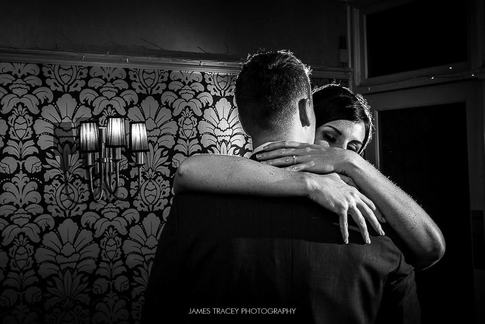 bride and groom hugging at broadoaks country house