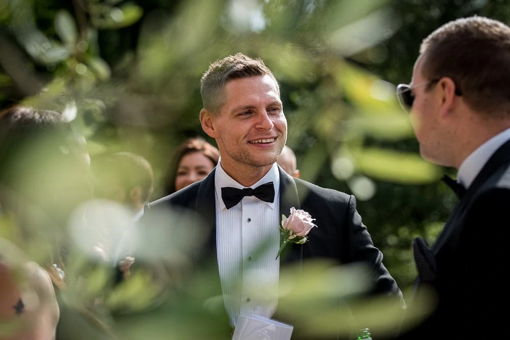 groom at upper house hayfield wedding reception