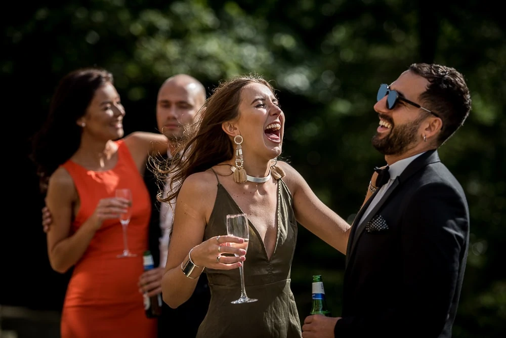 laughing wedding guests at upper house hayfield