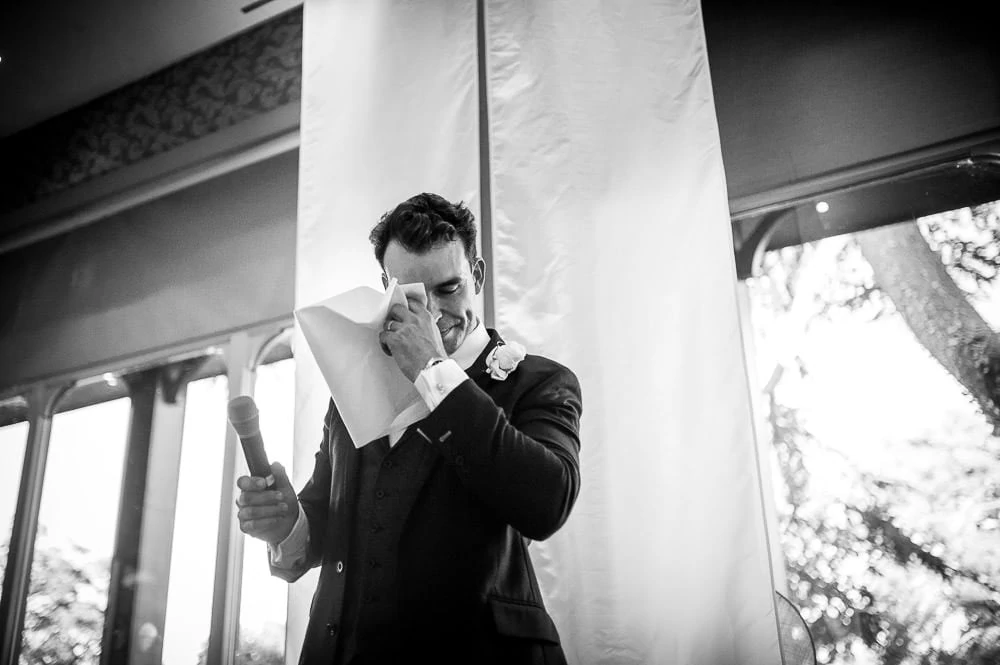 groom wiping tears from his eyes