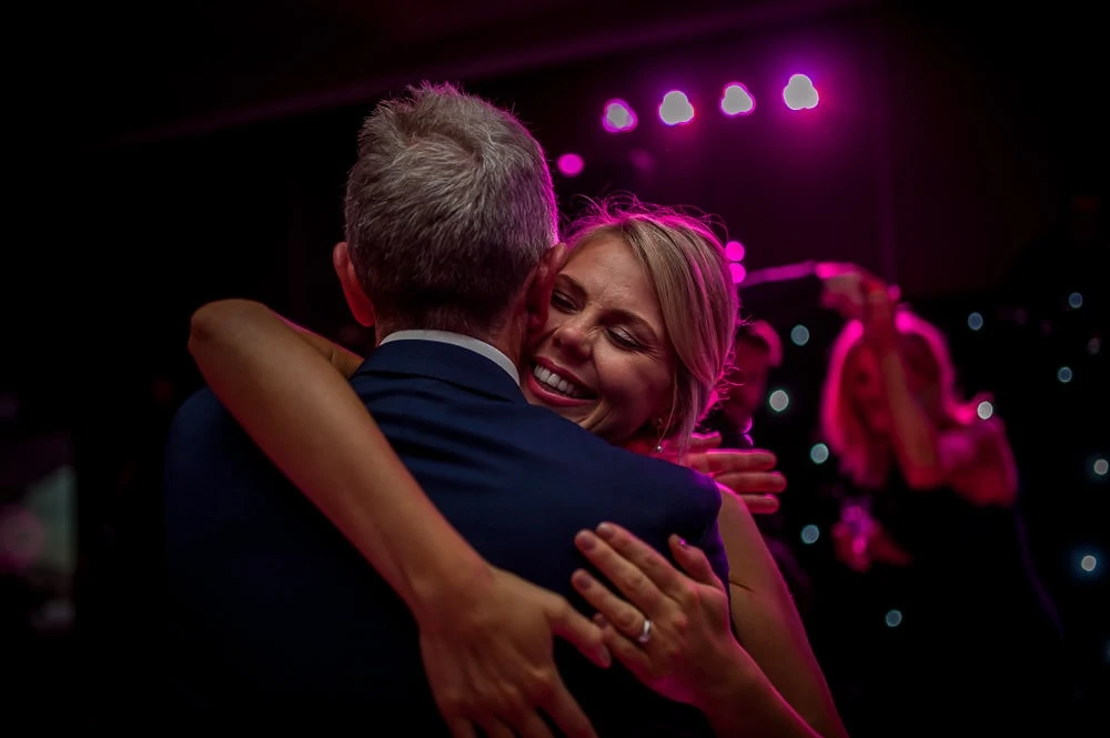 bride hugging her father