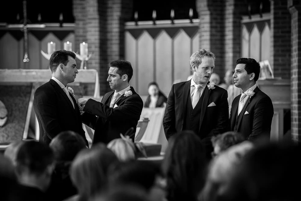 grooms and his groomsmen in church