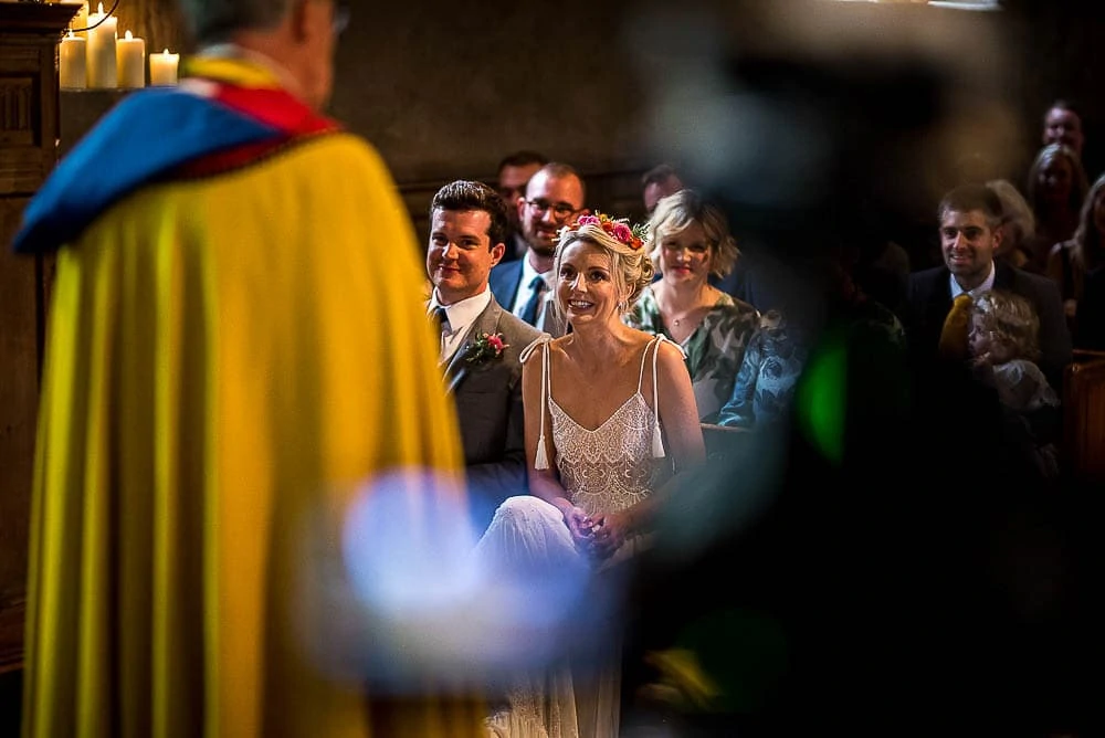 bride and groom smiling at their wedding