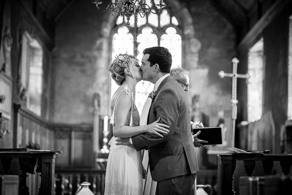 wedding first kiss in church