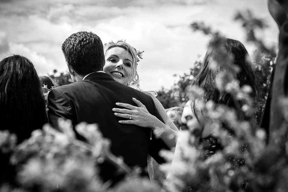 bride hugging a guest