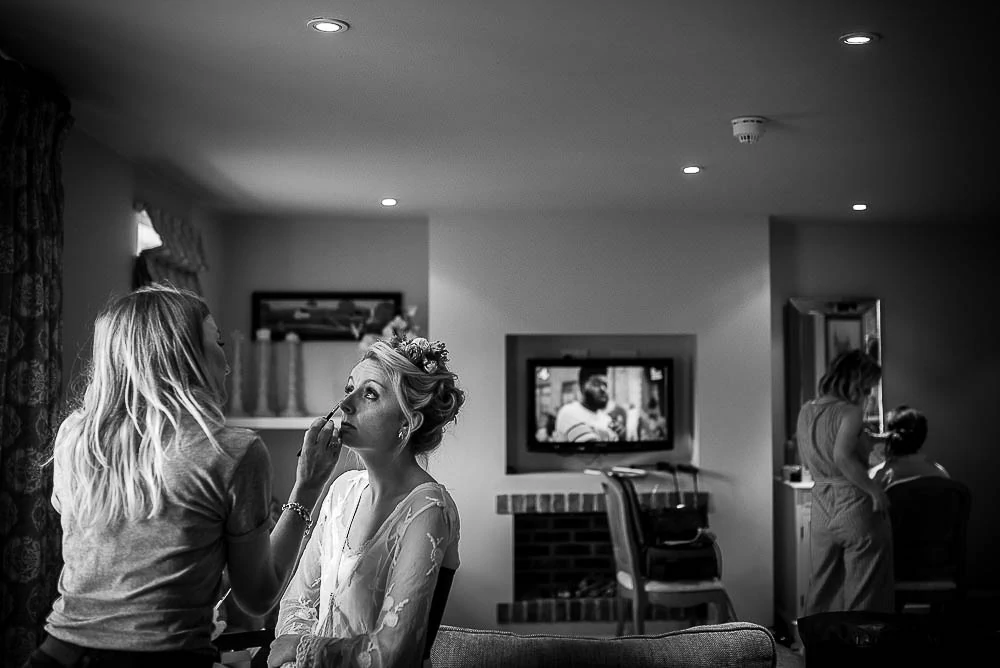 bride having her make up applied