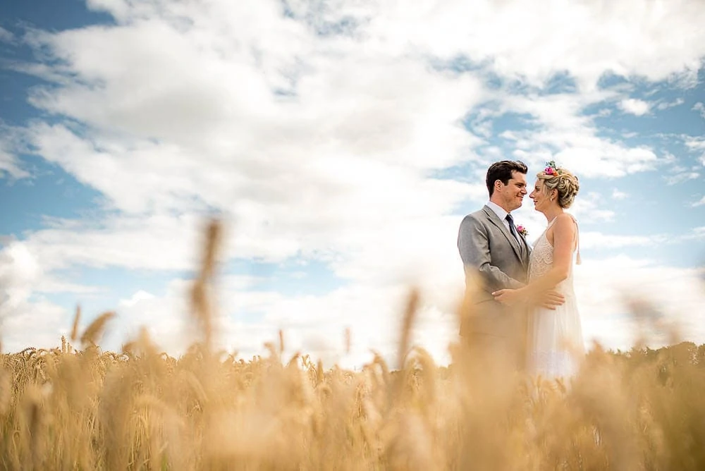 corn field wedding photo at priory cottages