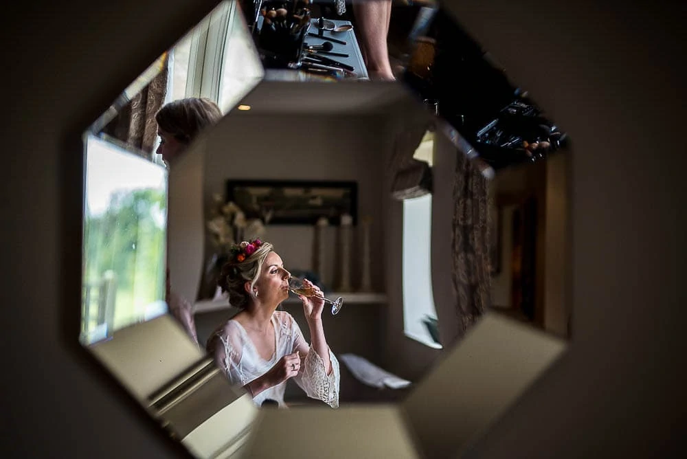 bride reflected in a mirror at priory cottages