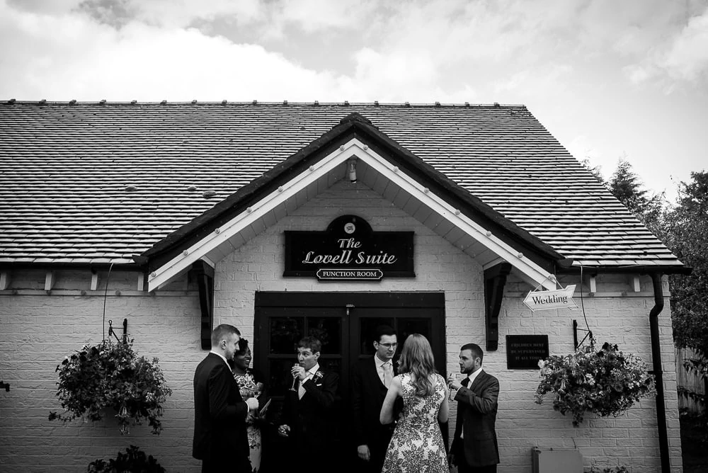 wedding guests outside the swettenham arms