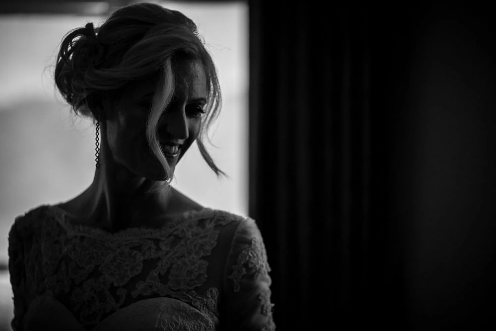 bride looking in mirror