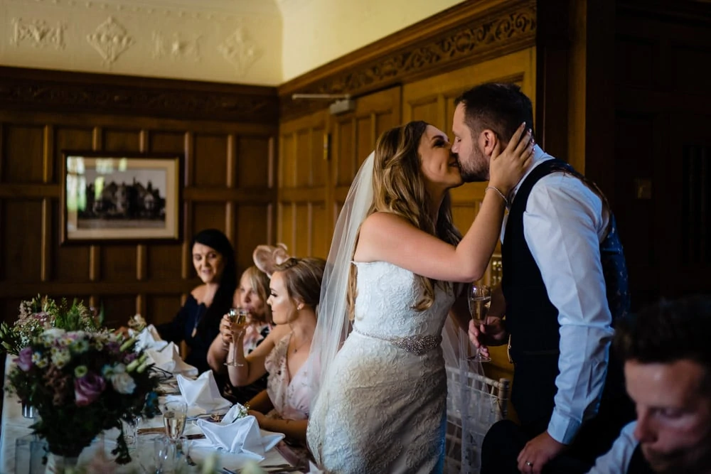bride kissing the groom after the speeches