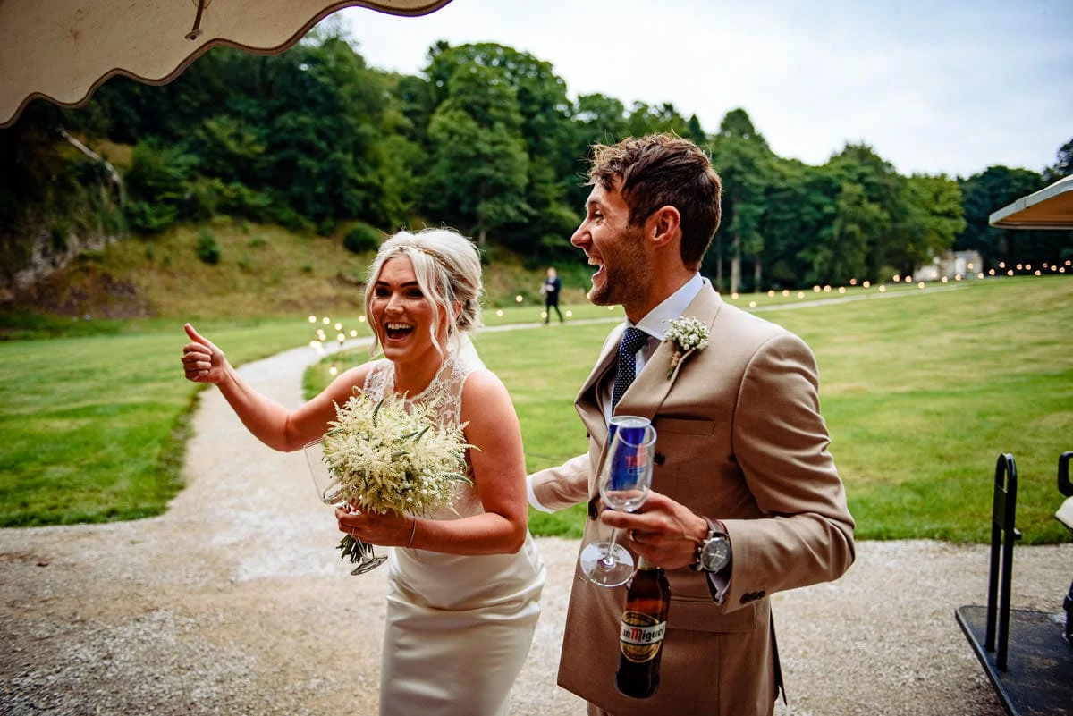 bride and groom arriving at their own wedding