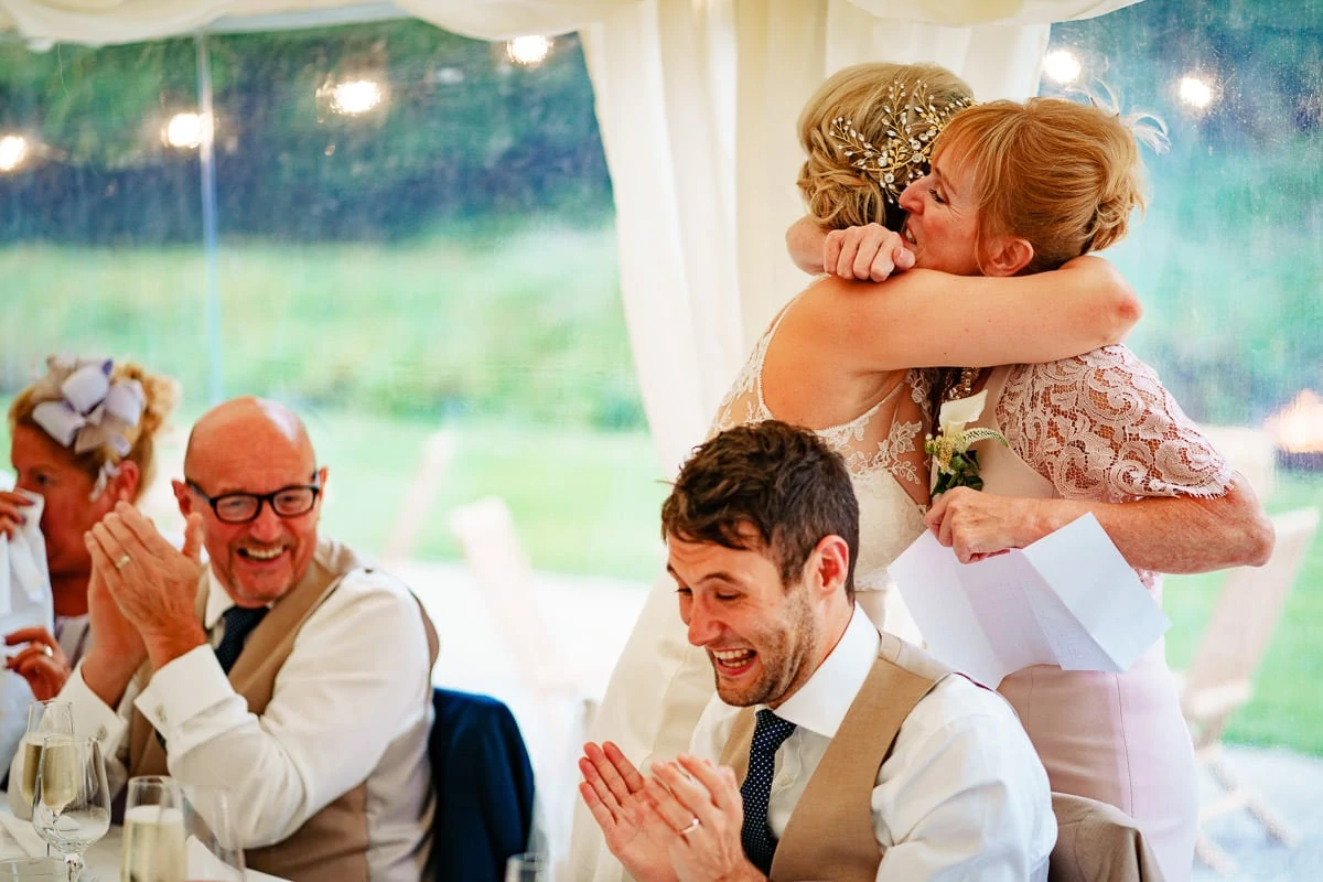 bride and mum hugs