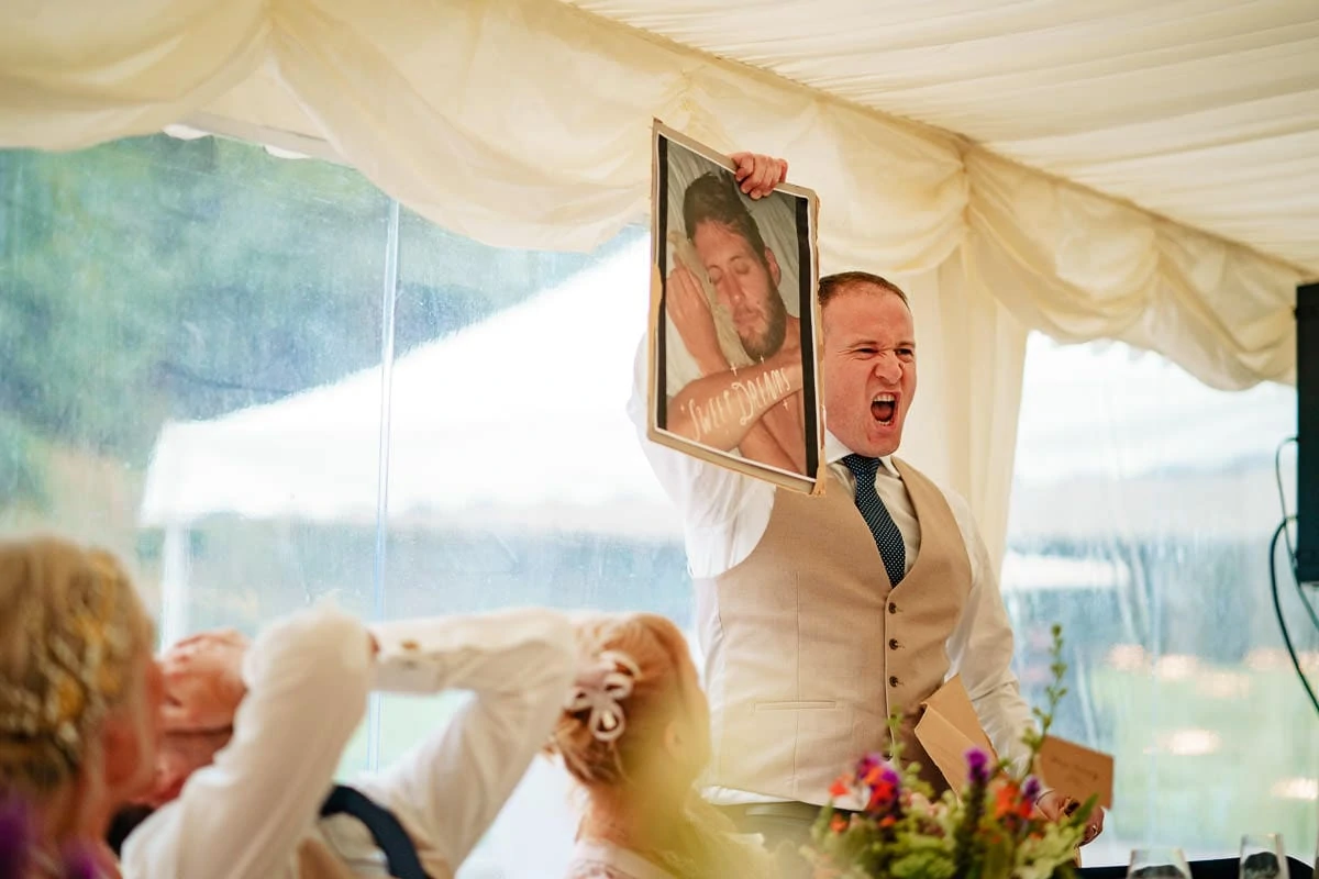 best man revealing grooms teddy