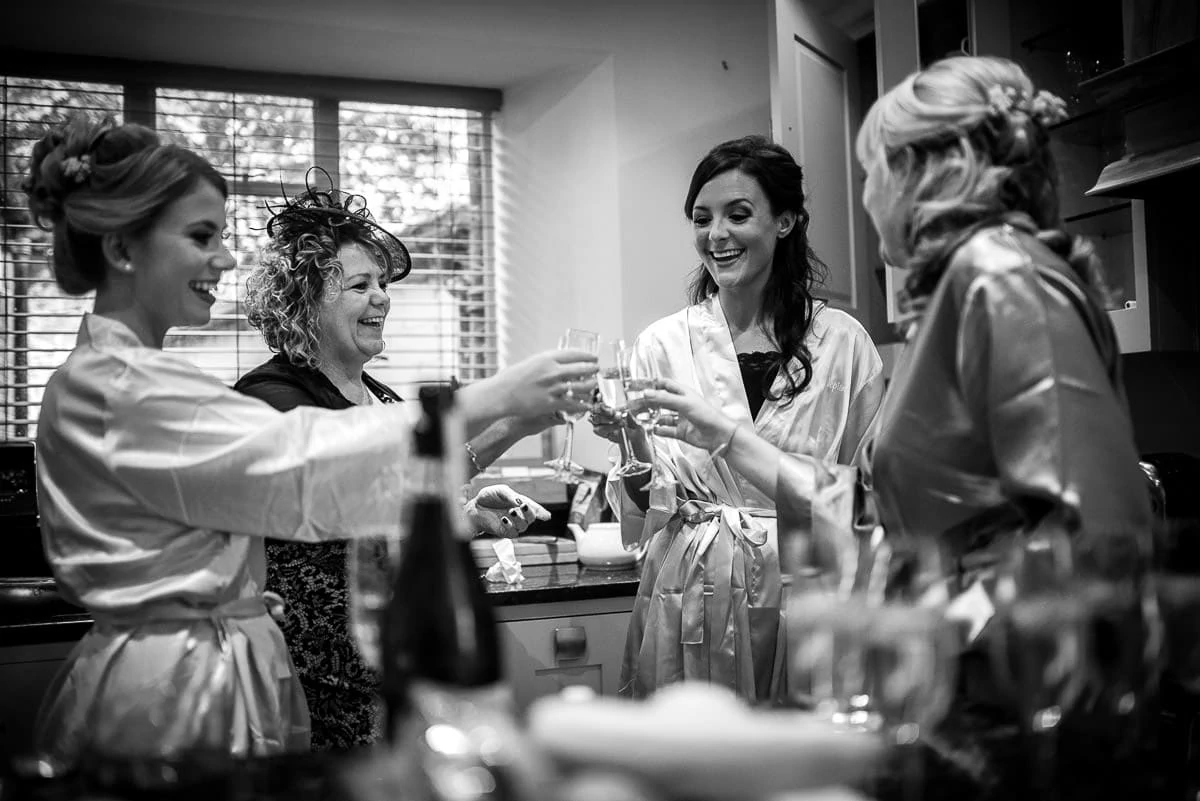 bride toasting her wedding with bridesmaids