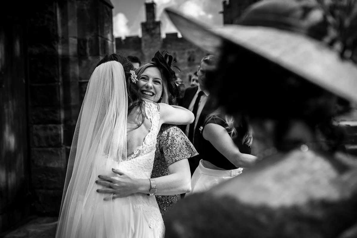 bride hugging guests
