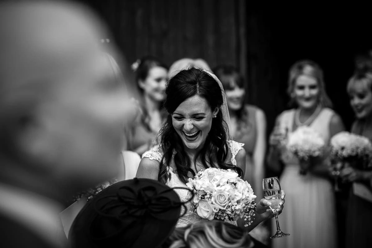 happy bride chatting to friends