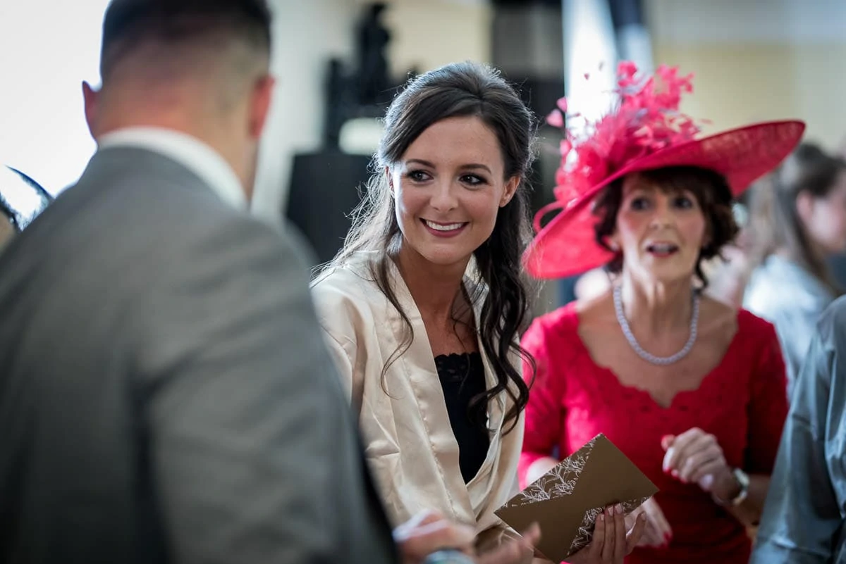 bride laughing at preparation