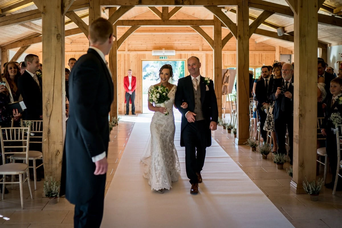 bride walking up the aisle atcolshaw hall