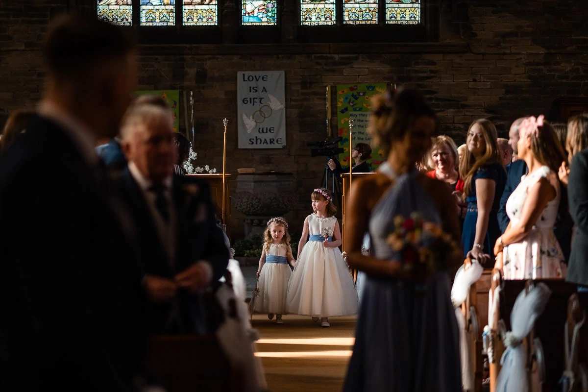 flower girl walking up the aisle